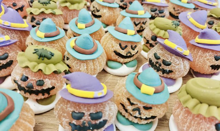 Halloween treats with colorful witch hats.